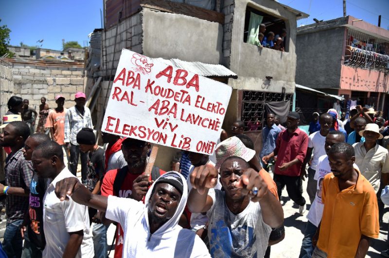 Supporters of opposition political parties march in Port au Prince on September 9