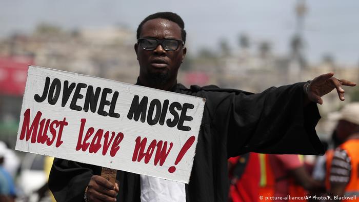 moise must leave sign credit DW